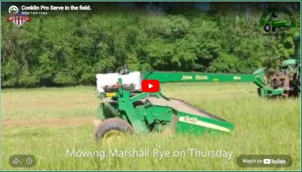 video thumbnail of a John Deer 946 mower conditioner with a tank to apply Pro-Serve mowing hay.